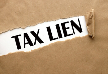 Tax lien text on torn paper .text in black font on white page