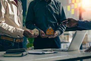 Real estate agents recommend interest rates, discuss the terms of the home purchase agreement, and ask clients to sign paperwork to legalize the contract.