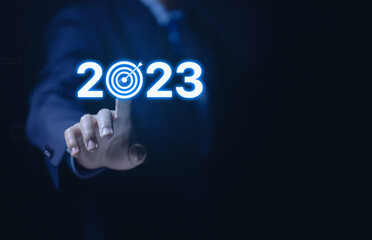Businessman hand showing 2023. Concept executes goals and strategy, New Year 2023. 