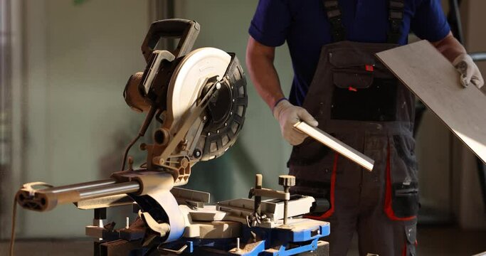 Electric saw for cutting wooden laminate shelves or laminate flooring. Features of cutting laminate