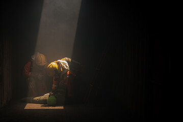 Two firefighters are working together to simulate a rescue scenario with the dummy models in the...