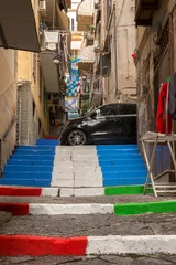 Kissenbezug Alleys of the Spanish quarters in Naples, Italy. The stairs are colored with the colors of Napoli Calcio and the Italian tricular. The city is celebrating its third championship in Serie A. © Stefano Tammaro