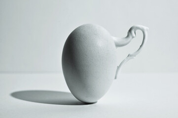 Egg and Shadow With Handle Of A  Cup