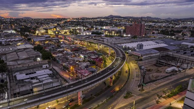 A mesmerizing hyperlapse showcasing the bustling cityscape of Zapopan and Guadalajara, featuring the Light Rail Transit System and a stunning sunset.