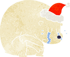 crying hand drawn retro cartoon of a polar bear wearing santa hat