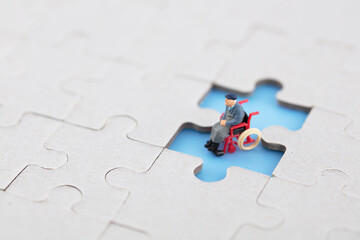 Miniature Creative Puzzle Blank and Lonely Wheelchair Elderly