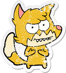 distressed sticker of a cartoon grinning fox