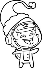 Fototapeta premium hand drawn line drawing of a laughing astronaut wearing santa hat