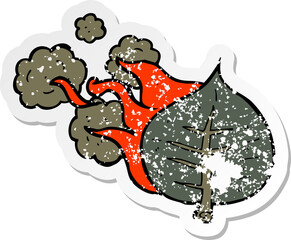 retro distressed sticker of a cartoon burning leaf