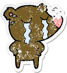 distressed sticker of a cartoon crying polar bear