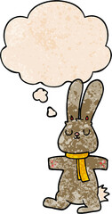 cartoon rabbit with thought bubble in grunge texture style