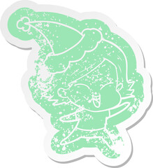 happy quirky cartoon distressed sticker of a girl wearing santa hat