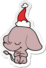 hand drawn sticker cartoon of a smiling elephant wearing santa hat