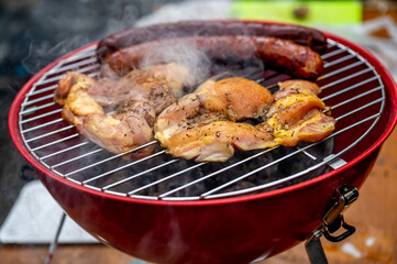 Red grill with sausage and chicken meat, preparation food.