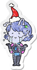 hand drawn distressed sticker cartoon of a crying alien girl wearing santa hat