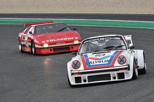 recommend clip art: Scarperia, 2 April 2023: Porsche 934-935 year 1976 in action during Mugello Classic 2023 at Mugello Circuit in Italy.
