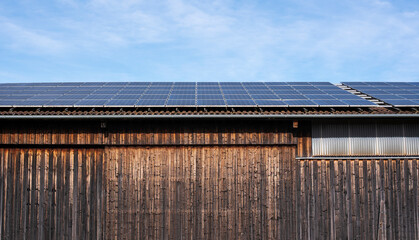 photovoltaic cells on the roof of a wooden barn