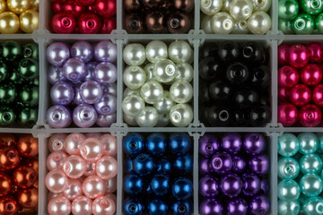 Coloured Jewellery Beads in a Plastic Partitioned Container