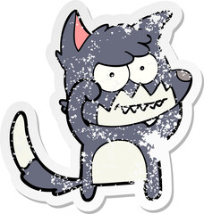 distressed sticker of a cartoon grinning fox