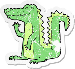 retro distressed sticker of a cartoon crocodile