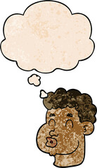 cartoon male face with thought bubble in grunge texture style