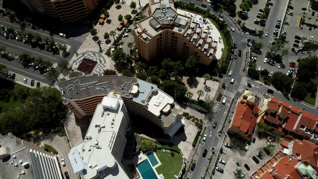 Aerial spiral reveal of Vilamoura Marina and surrounding beaches in the Algarve coast of Portugal
