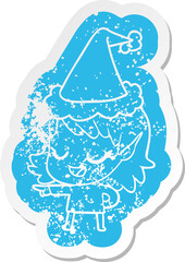 happy quirky cartoon distressed sticker of a elf girl pointing wearing santa hat