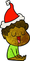 laughing hand drawn textured cartoon of a man wearing santa hat