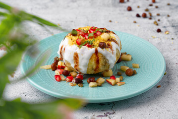 Raj Kachori has crispy fried shells filled with potatoes, yogurt, boiled lentils, spices, chutney & more! It's the the ultimate Indian chaat!