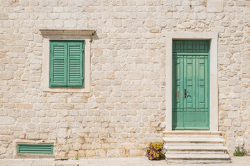 Fototapeta na wymiar Architectural detail, doors and windows of old stone houses in town and Sibenik, Croatia