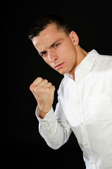 Young attractive man posing in the studio.