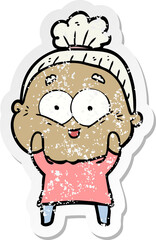 distressed sticker of a cartoon happy old woman