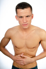 Pain. Young attractive man and health problems.	