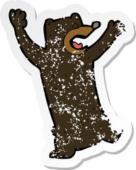 retro distressed sticker of a cartoon black bear