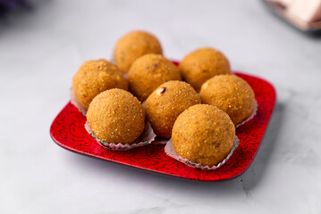 Besan ladoo are delicious & aromatic sweet balls made with gram flour, sugar, ghee and cardamom powder