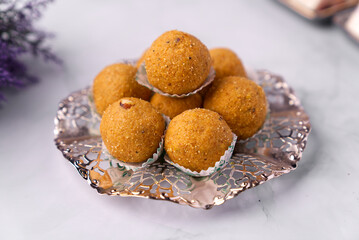 Besan ladoo are delicious & aromatic sweet balls made with gram flour, sugar, ghee and cardamom powder