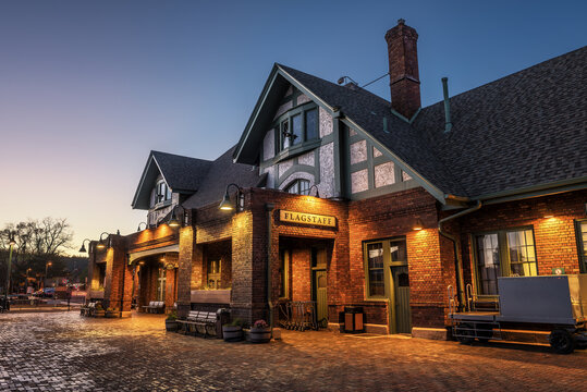 FLAGSTAFF, ARIZONA, USA - MAY 16, 2016 : Historic train station in Flagstaff at sunset. It is located on Route 66 and is formerly known as Atchison, Topeka and Santa Fe Railway depot. Hdr processed.