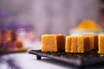 Mysore pak is an Indian sweet prepared in ghee. It originated in the city of Mysore