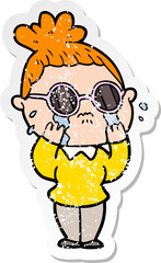 distressed sticker of a cartoon crying woman wearing spectacles