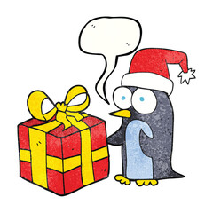 freehand drawn texture speech bubble cartoon christmas penguin with present