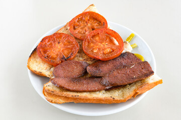 Grilled chili, tomato and sucuk between bread. ( Sucuk ekmek ) 
