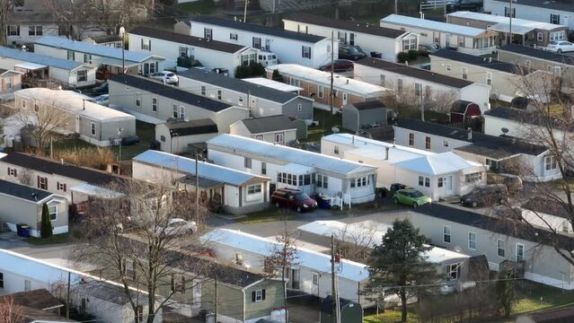 Rural working poor community in USA. Aerial view of American trailer park with mobile home trailers.