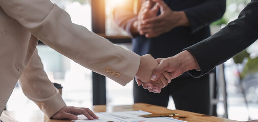 Fototapeta premium Business people shaking hands, finishing up meeting, business etiquette, congratulation, merger and acquisition concept.