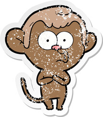 distressed sticker of a cartoon hooting monkey