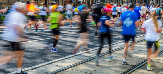 marathon runners in motion .