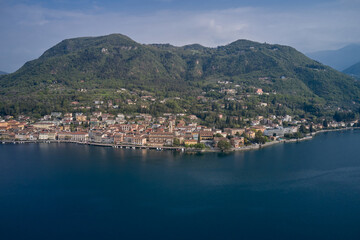 Naklejka na ściany i meble View of the historic part of Salò on Lake Garda Italy. Aerial view of the town on Lake Garda. Tourist site on Lake Garda. Lake in the mountains of Italy.