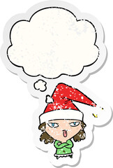 cartoon girl wearing christmas hat with thought bubble as a distressed worn sticker