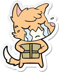 sticker of a crying fox cartoon with parcel