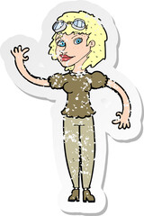 retro distressed sticker of a cartoon pilot woman waving