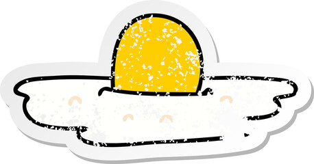 distressed sticker of a quirky hand drawn cartoon fried egg